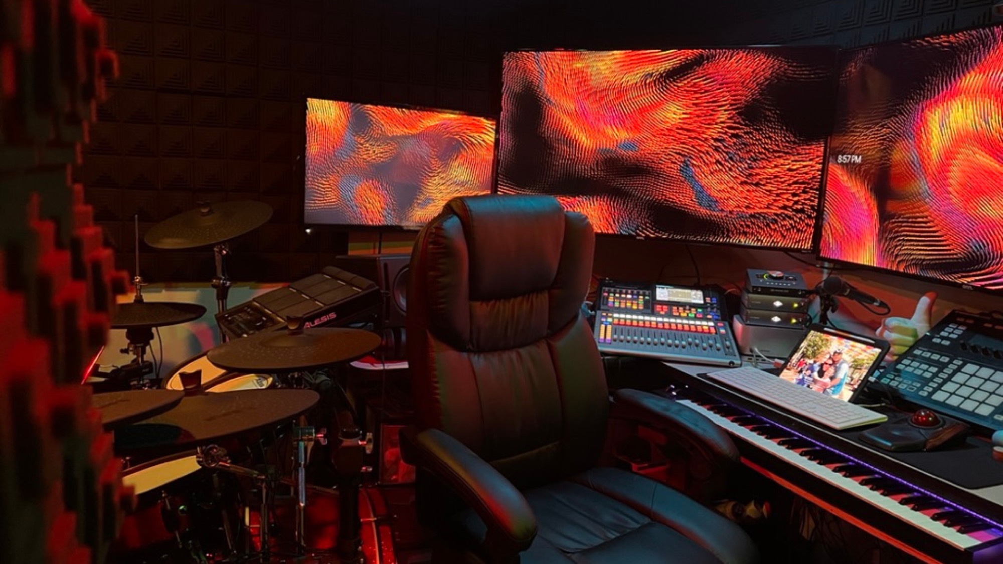 Inside EDHAT Studios — mixing console, drums, and displays