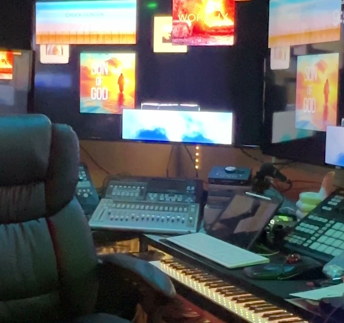 Inside EDHAT Studios — console, keyboard, and screens